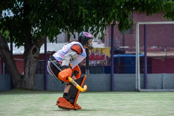 field hockey goalkeeper save